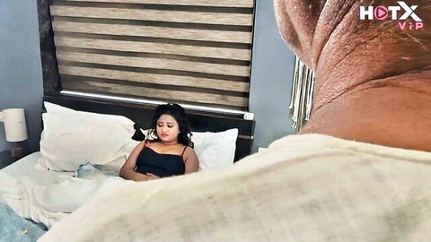 Indian Nikdelhi lying in bed in black tank top with Sasurji approaching from behind