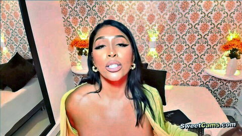 Thick Latina exposing big tits in green top on cam