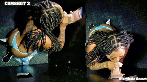 Tattooed black woman with braids in bikini swallows cum at gloryhole