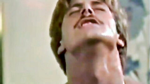 Vintage 1984 adult scene with blonde mustached man in close-up ecstasy