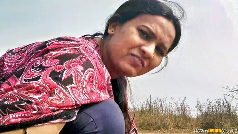 Desi Indian wife in pink shawl posing outdoors in POV tease