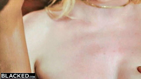 Topless blonde with big perky tits and gold necklace exposing her bare breasts