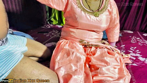 Curvy Indian woman in pink embroidered salwar kameez with hairy man in blue underwear on bed