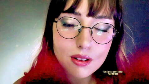 Seductive glasses girl with glossy pink lips and septum piercing closeup tease