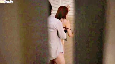 Hot Asian MILF in black lingerie embraced from behind by Japanese man