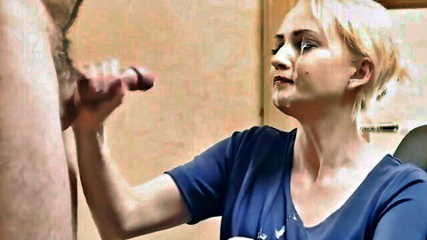 Blonde with teary eyes strokes thick erect cock with hand in closeup handjob