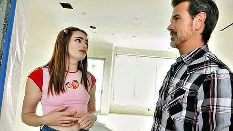 Reese Robbins in pink strawberry crop top and shorts chats with older man