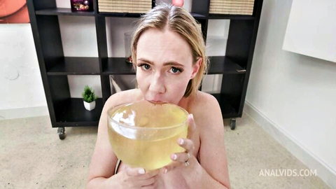 Skinny blonde with small tits naked slurping thick cum from glass bowl