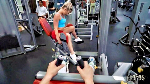 Kelsey Kane in blue sports bra on leg press, POV gym workout tease