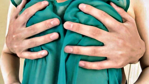 Rei Furuse teasing with hands cupping breasts in sheer green top