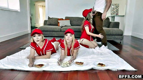 Three blonde teen batters in red baseball uniforms tease POV action with popcorn
