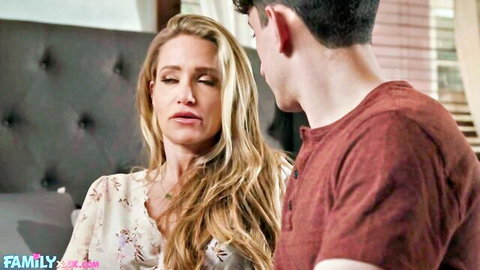 Blonde stepmom in floral top shares intimate moment with stepson on bed