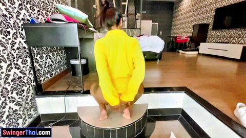 Lily Koh Thai MILF housewife squatting in yellow tracksuit, big ass POV tease