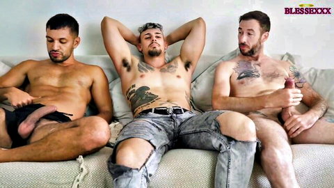 Tattooed muscular Latino men exposing cocks in gay interracial threesome preview