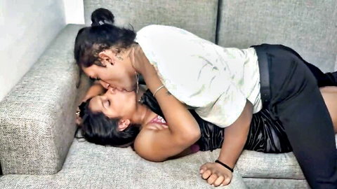 Two Indian women passionately kissing in intimate lesbian embrace