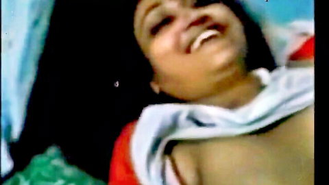Smiling Desi Telugu aunty exposes breasts in naughty close-up