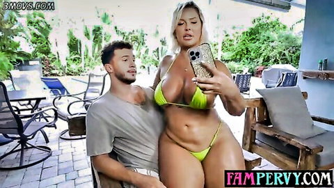 Jenna Starr BBW MILF in yellow bikini selfie with hunk, poolside tease