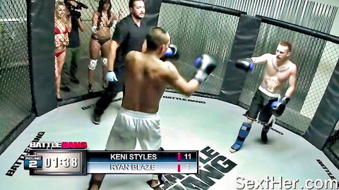 Kenny Styles boxes Ryan Blaze in Battle Bang cage with busty bikini babes watching sexfight