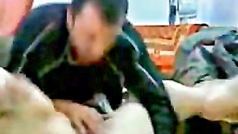 Man performs cunnilingus on spread-legs Arab wife exposing wet pussy.