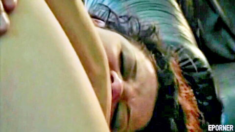Busty girl in vintage porn, close-up of relaxed face and exposed large breasts