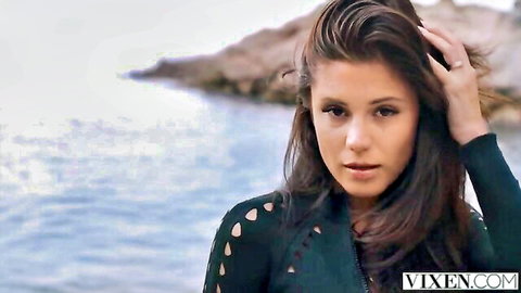 Cute brunette in sexy green top teases by the sea, ready for anal sharing fun