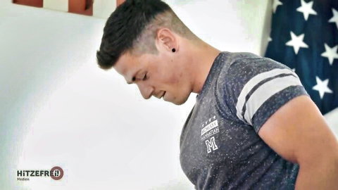 Muscular European man in gray t-shirt, side profile view