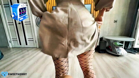 Sweet Herry bending over in trench coat, showing big ass and fishnet stockings