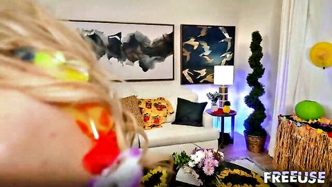 Blonde hair closeup in freeuse Halloween party room with sofa balloons and decorations
