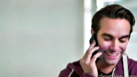 Handsome man smiling on phone in hoodie and apron, stepmother scene tease