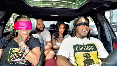 Zerella Skies blindfolded smiling in car with friends, casual group vibe