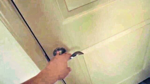 Hand turning doorknob in Worlds Greatest Stepmom adult video tease