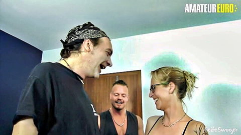 Blonde German mature huge tits laughing with two young studs in amateur threesome preview