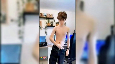Shirtless slim young man posing topless in casual pants