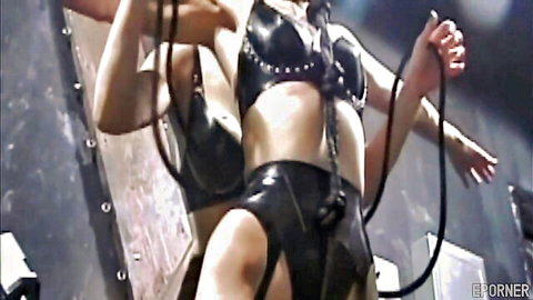 Two kinky MILFs in latex engaging in lesdom play