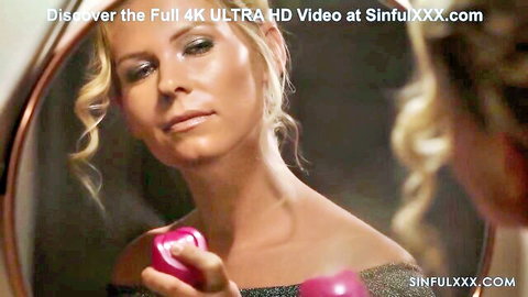 Blonde woman in sparkly dress gazing in mirror, holding pink toy seductively