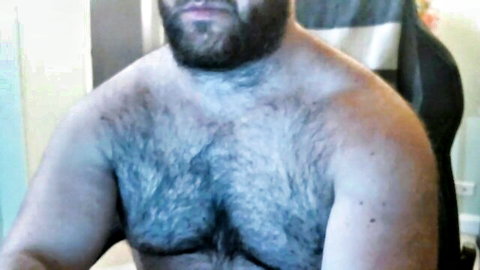 Hairy bearded guy topless in amateur gay cruising video