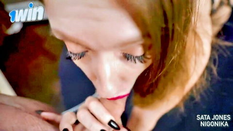 Redhead Sata Jones sucks thick cock with red lips and black nails in intense closeup blowjob