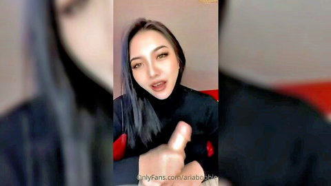 Asian babe Ariaboobie in black top giving JOI on OnlyFans