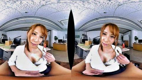 Smiling Asian office girl in low-cut blouse showing cleavage in VR POV