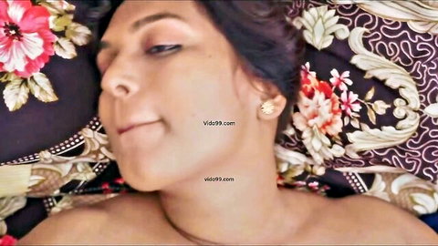 Indian chunky mom with big tits lying nude, smiling seductively