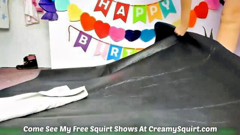 Young babe in birthday party setup squirting over protective tarp