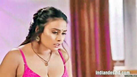 Busty Indian babe in tight pink bra showing massive cleavage tits