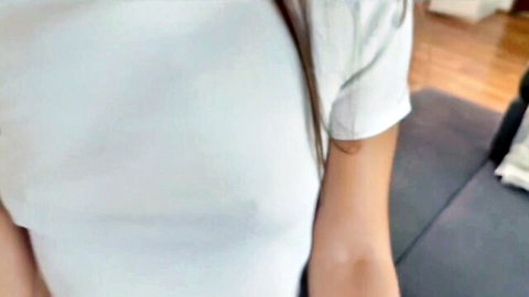 Busty girl in tight white t-shirt showing huge tits and hard nipples through fabric