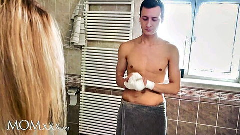 Blonde MILF Dayna Ice in steamy bathroom with skinny young lover, topless towel tease