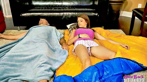 Dillion Carter lying clothed next to stepdad on sleeping bags before taboo fun