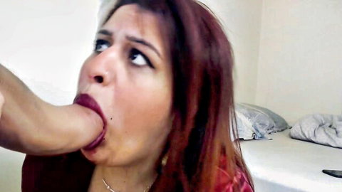 Redhead Latina woman with wide eyes performing deep oral on man in taboo stepbrother scene