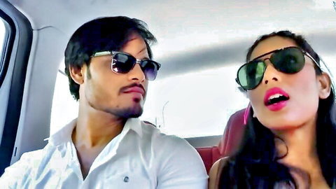 Desi couple in car, sunglasses, flirty smiles, wife teases hubby