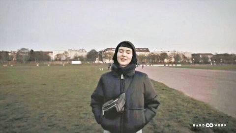 Delfine smiling in black puffer jacket outdoors, HARDWERK teaser