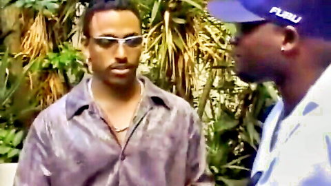 Retro close-up of two Black men in intimate outdoor chat