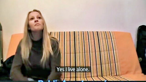 Blonde Lucie with huge tits in sweater, saying she lives alone